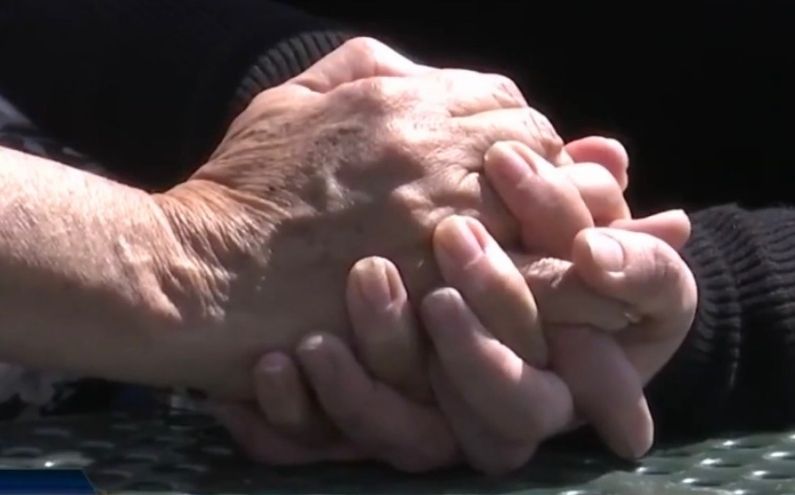 Mother and daughter holding hands