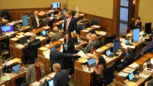 Lawmakers at their desks during a meeting in the Wyoming House of Representatives