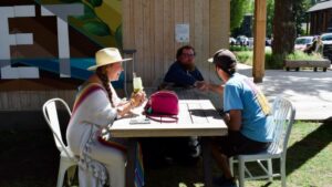 Members of Jackson's GroupMe leadership talk outside of Healthy Being Cafe.