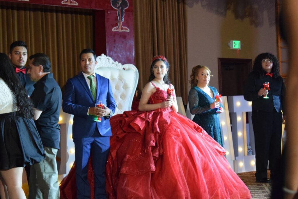 Madeline and her parents, Diego and Berta, prepare a toast for everyone who helped put the party together. From the music, to the decorations, to the cake. (Dante Filpula Ankney / KHOL)
