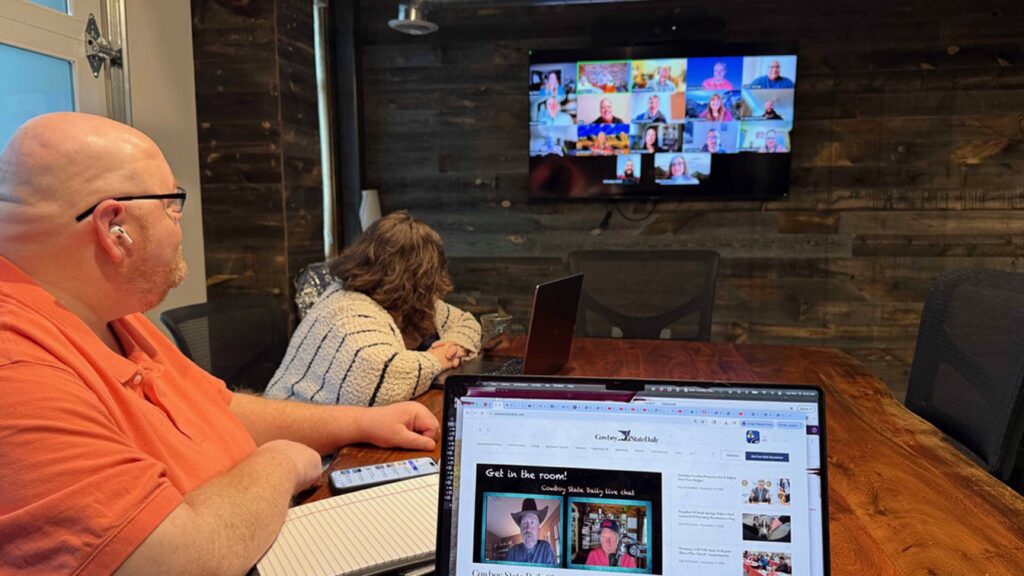 Cowboy State Daily Managing Editor Greg Johnson listens to a morning staff meeting on Nov. 18. The media organization’s staff has grown since Hughes Jr. purchased the publication in 2022. (courtesy Jimmy Orr)