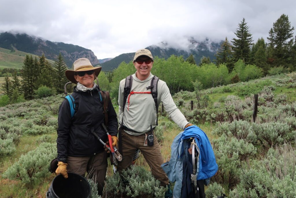 Gretchen Plender, left, and John Freeze regularly dedicate their Saturdays to making more permeable paths for wildlife. (Jenna McMurtry / KHOL)